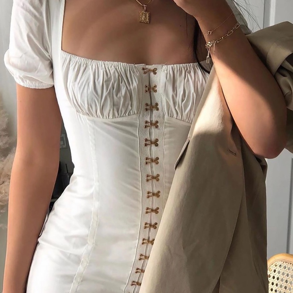 NWT. White mini dress with gold claps